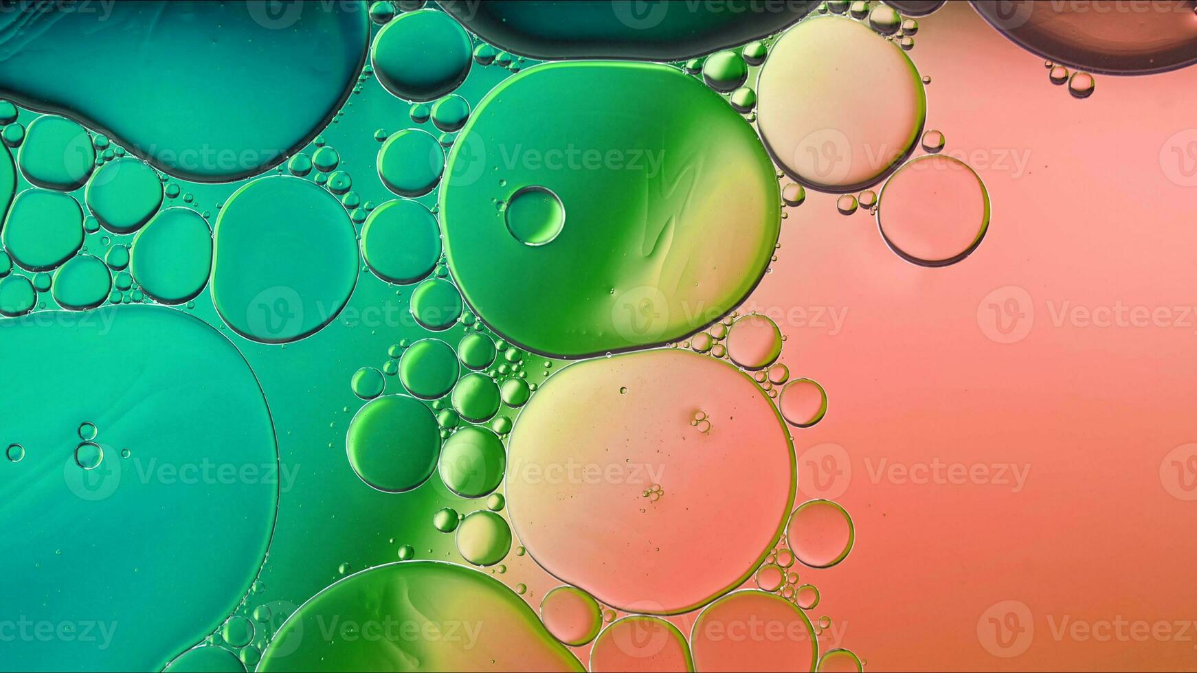 Abstract Colorful Food Oil Drops Bubbles and spheres Flowing on Water Surface photo