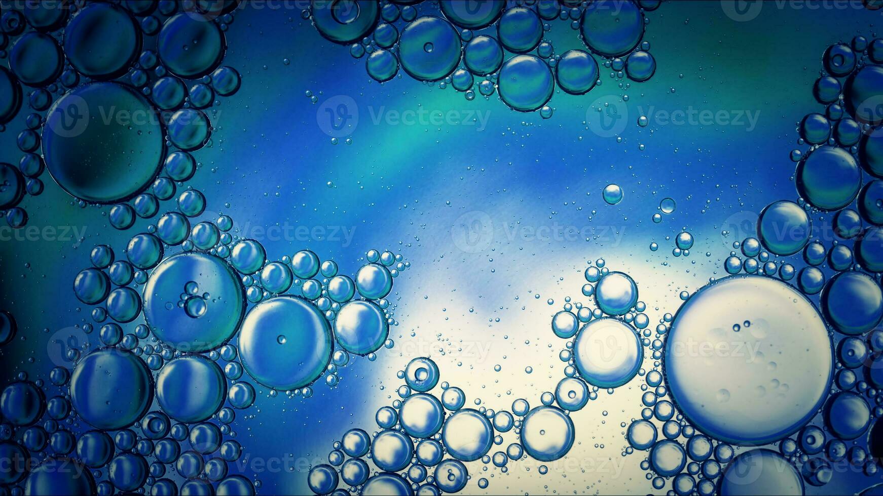Abstract Colorful Food Oil Drops Bubbles and spheres Flowing on Water Surface photo