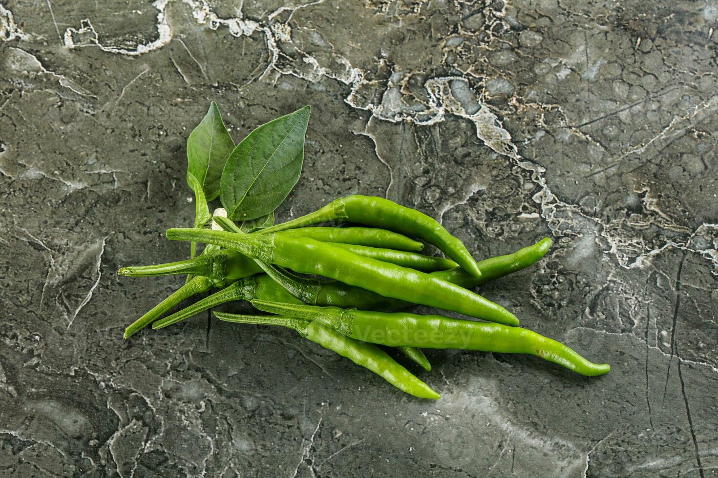 Spicy green chili pepper heap 35335406 Stock Photo at Vecteezy