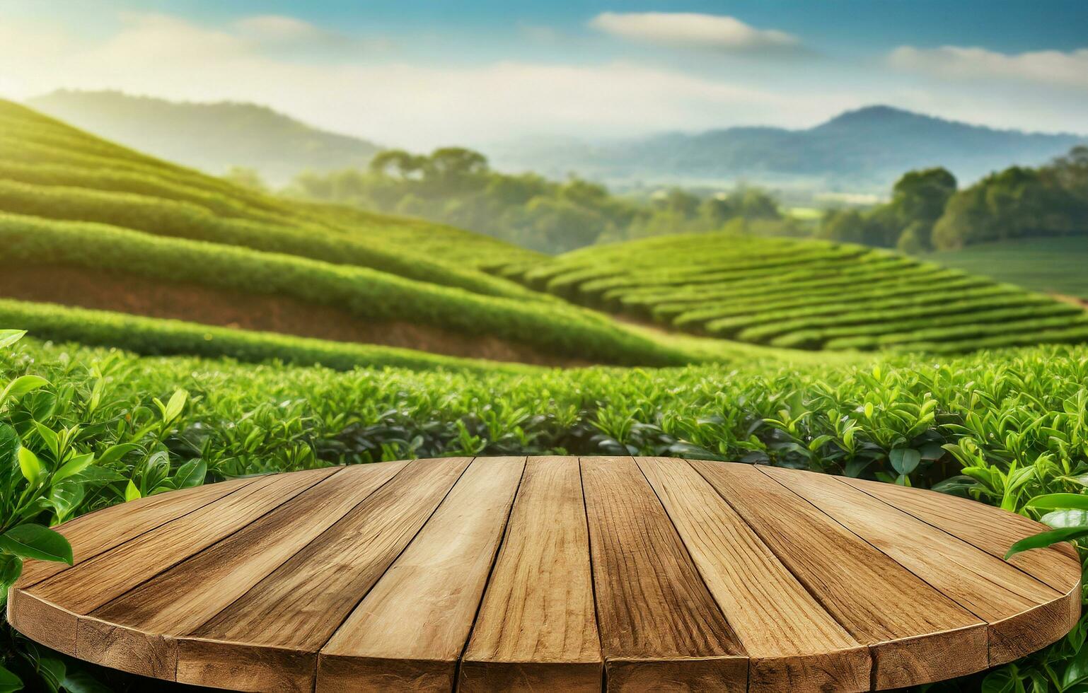 Circle wooden table top with blurred tea plantation landscape against blue sky and blurred green leaf frame Product display concept natural background photo