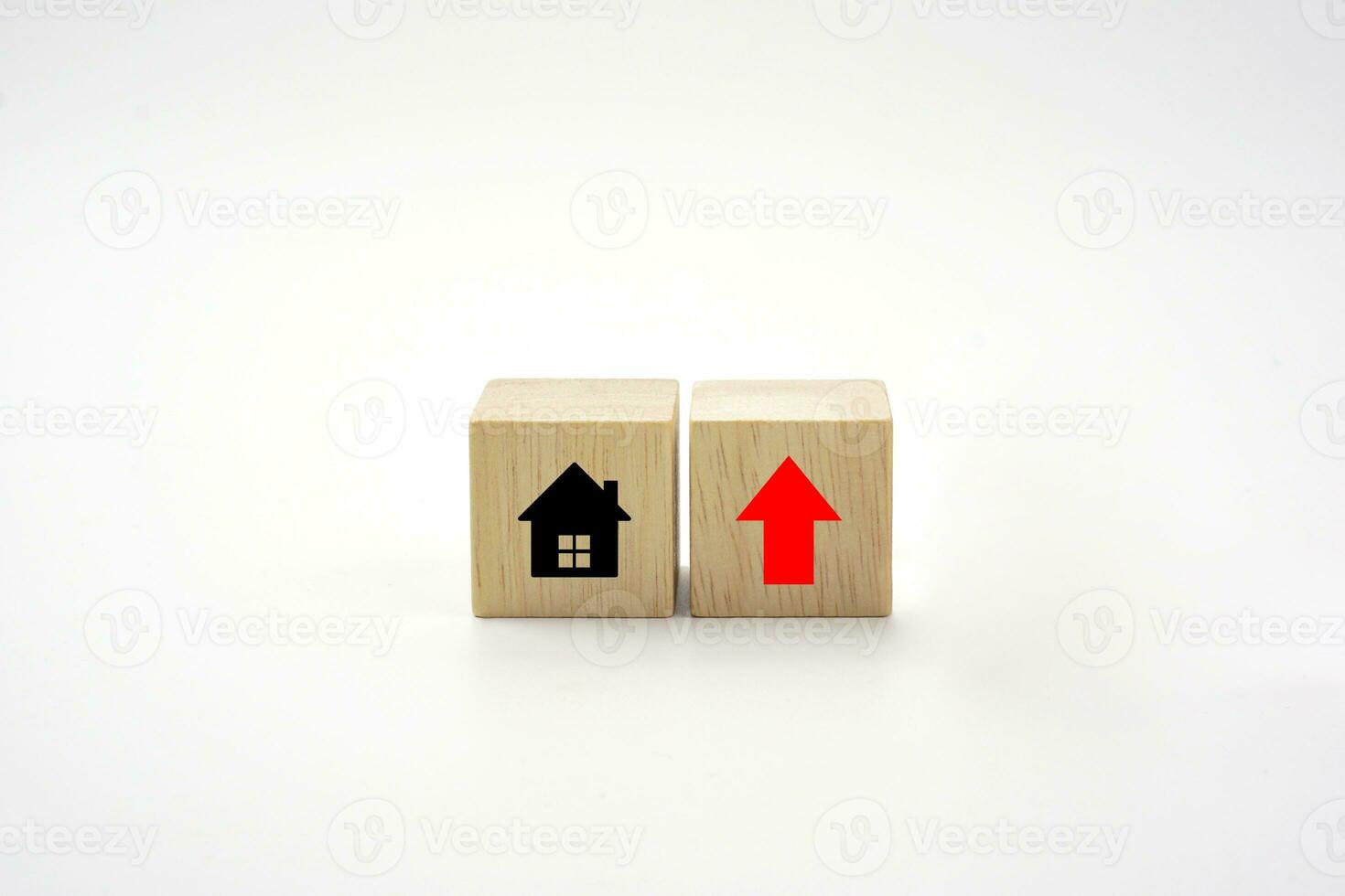 House icon on wooden block and up of arrow. Interest rate finance, real estate and house loan concept. photo