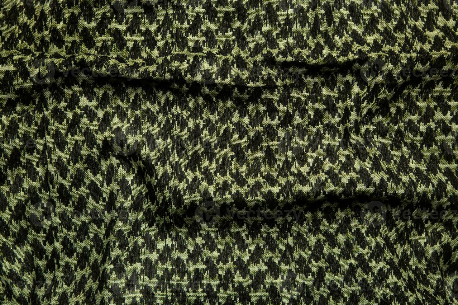 Keffieh scarf. The texture of the cotton traditional symbolic arabian scarf. Khaki back. photo