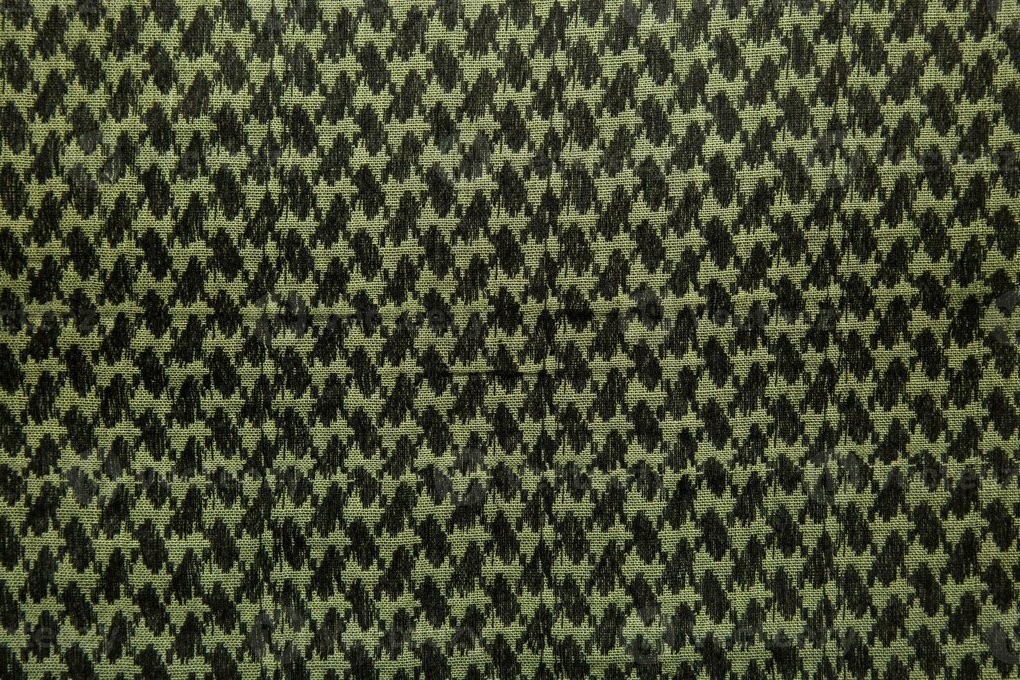 Keffieh scarf. The texture of the cotton traditional symbolic arabian scarf. Khaki back. photo
