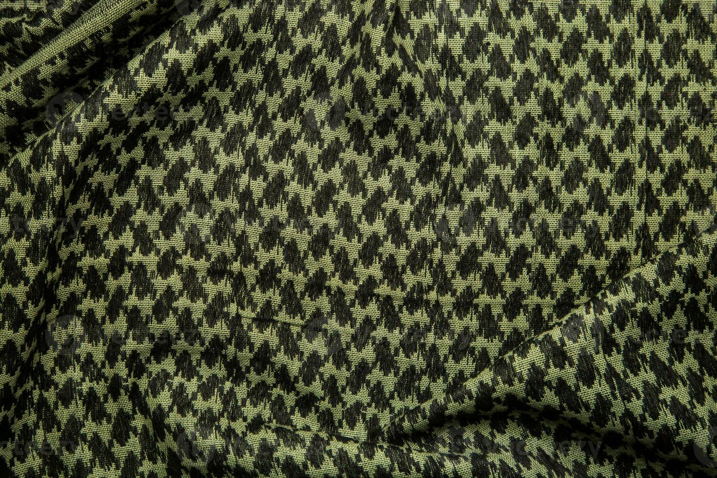 Keffieh scarf. The texture of the cotton traditional symbolic arabian scarf. Khaki back. photo