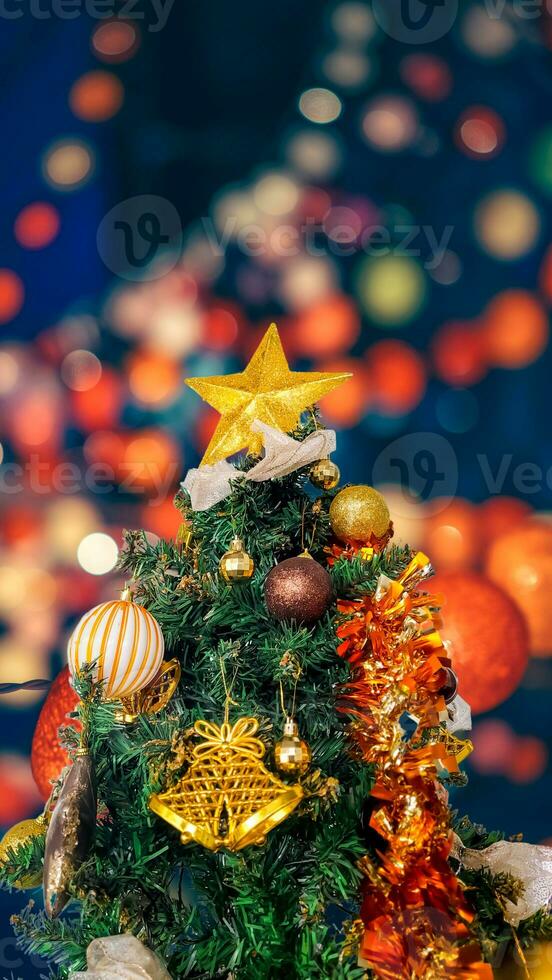 Portrait and Close up of christmas tree with decorations, copy space area, blur light background. photo