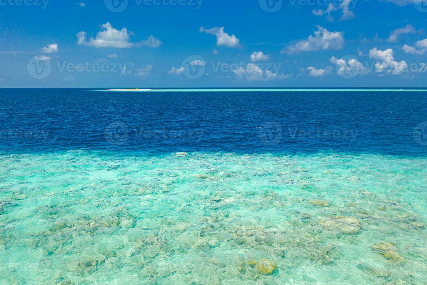 Shades of blue. Beautiful coral reef in Maldives island, aerial landscape, shallow sea water as lagoon. Amazing exotic nature texture underwater and ocean surface. photo