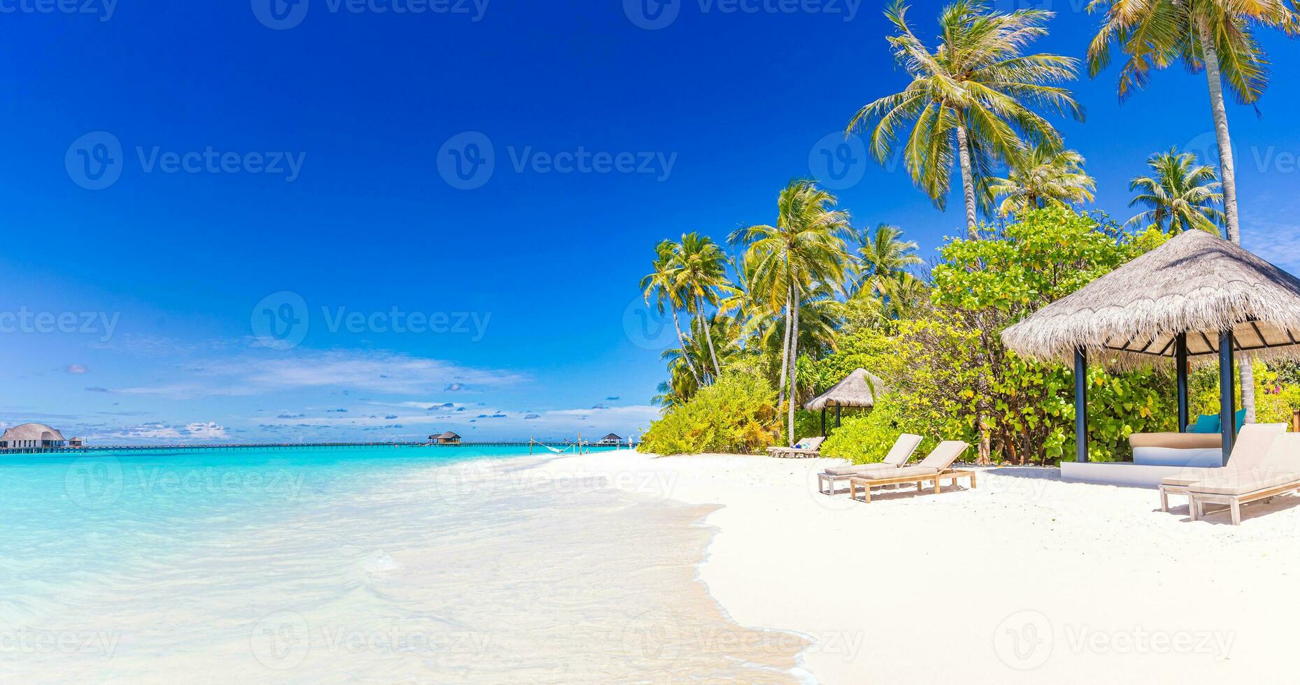 Tropical beach background as summer landscape. Carefree beach hut bungalow white sand and calm sea for beach banner. Perfect beach scene vacation and summer holiday concept. Boost up color process photo