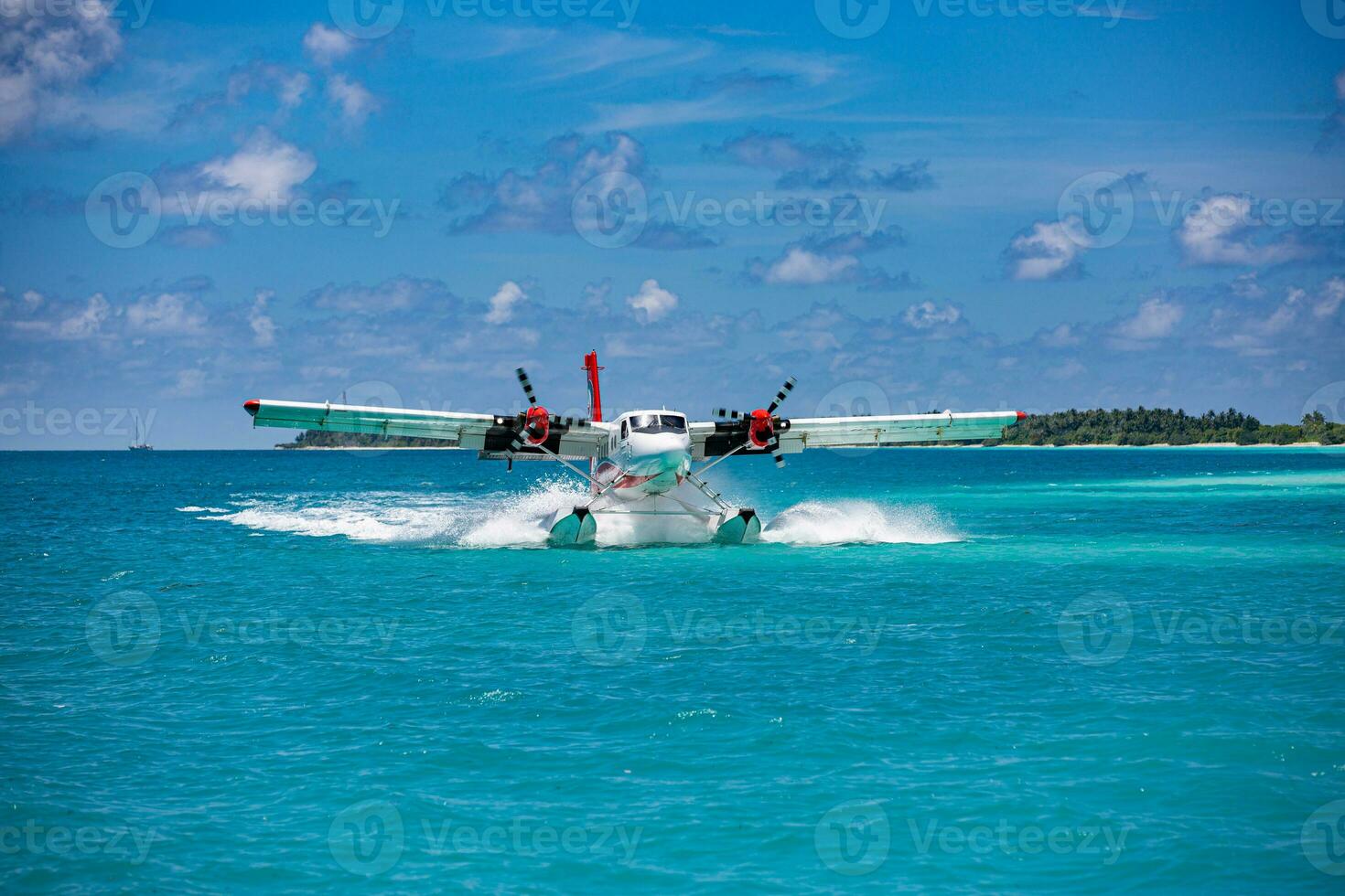 Exotic scene with seaplane on Maldives sea landing. Vacation or holiday in Maldives concept background, luxury travel transportation exotic destination scenic photo