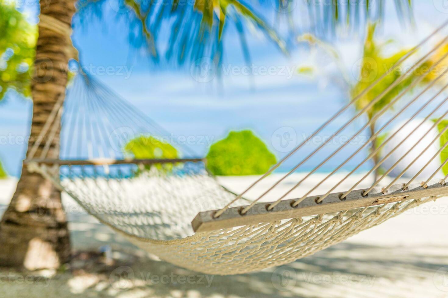 Tropical hammock in paradise at sunset, closeup recreational summer background. Relaxation, carefree beach scene, palm leaves, sunset light. Tranquil beautiful couple leisure tropical lifestyle photo