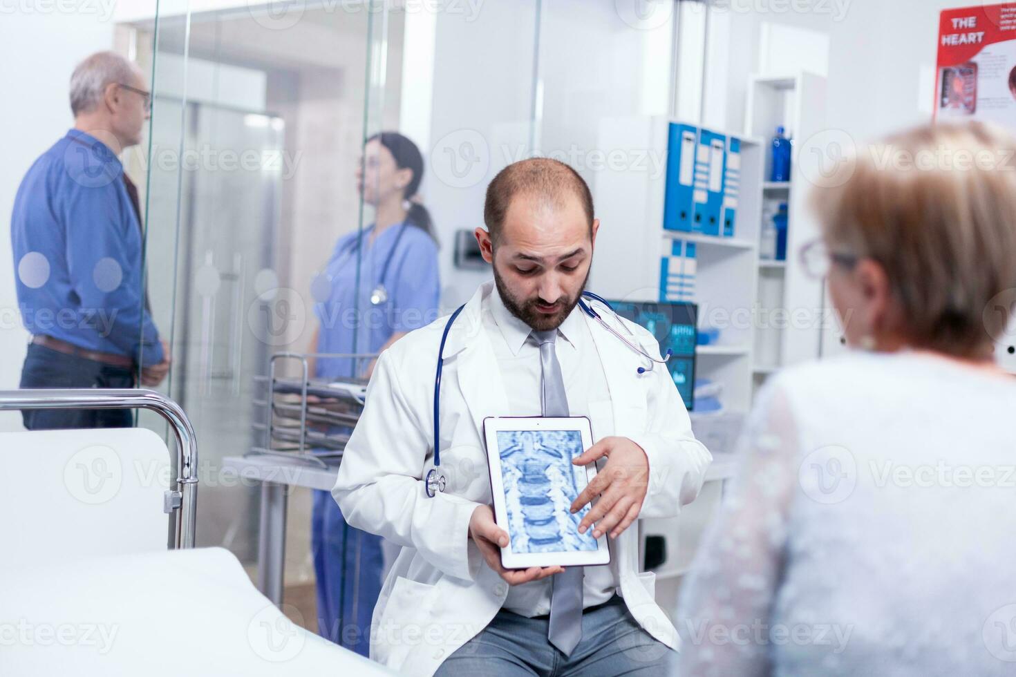 Doctor discussing about bones disease with senior woman during medical examination in hospital. Medical services medicine healthcare wellbeing support, physician working photo