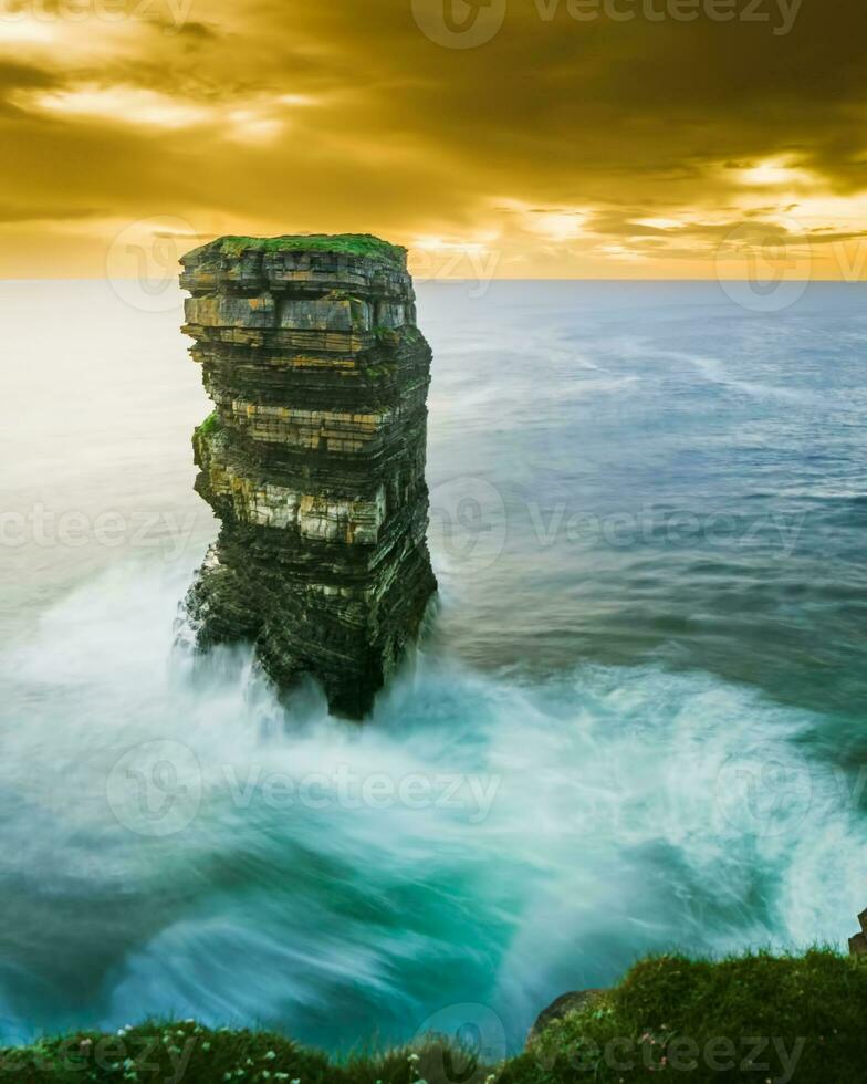 Dun Briste Sea stack Downpatrick Head Wild Atlantic Way Ireland. Beautiful sunset over wild atlantic coast photo