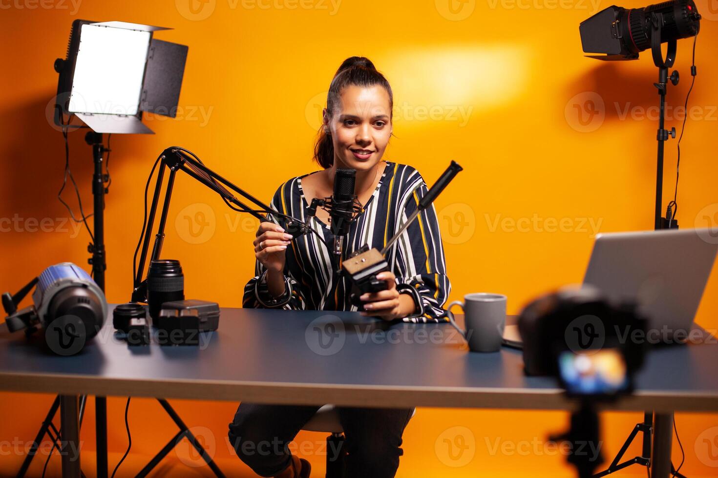 Presenting fluid head plate for videography tripod recording vlog. Social media star making online internet content about video equipment for web subscribers and distribution, film photo