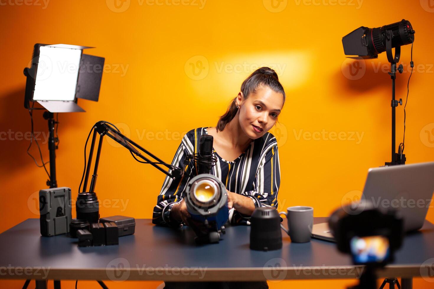 Presenting studio light for vlog production in home studio. Social media star making online internet content about video equipment for web subscribers and distribution, film photo