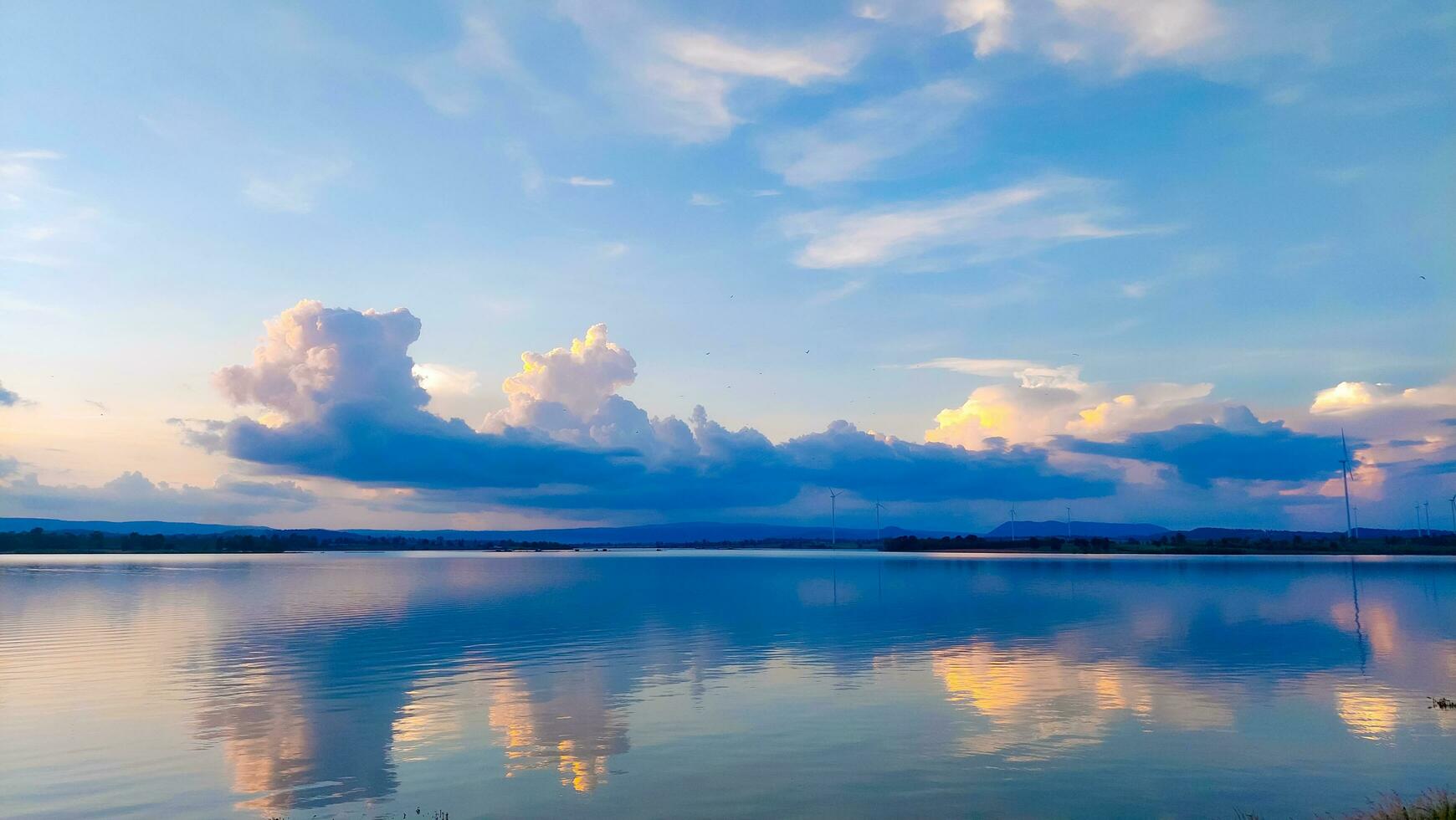 Sunset reflection and clouds in the reservoir photo