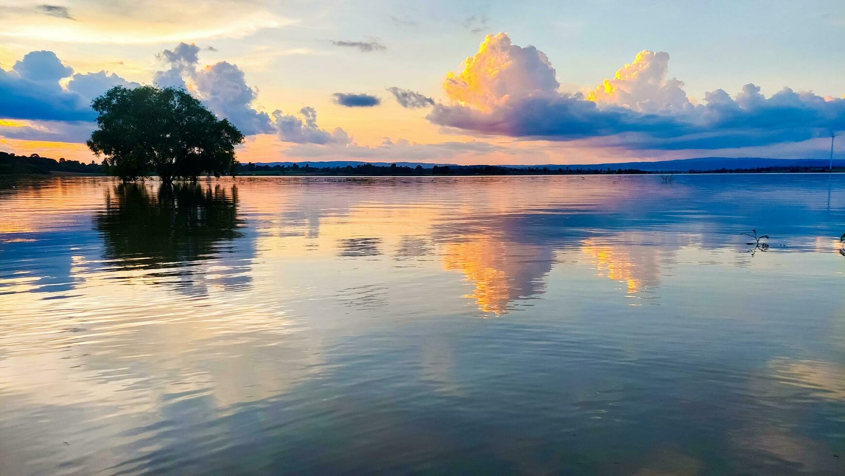 Sunset reflection and clouds in the reservoir photo