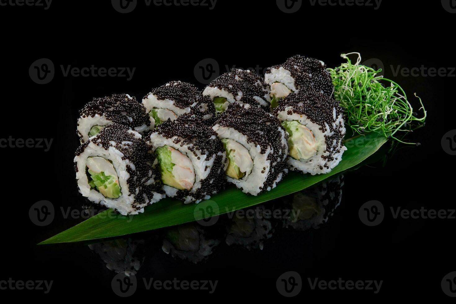 California rolls in black tobiko with crab, avocado, cucumber photo