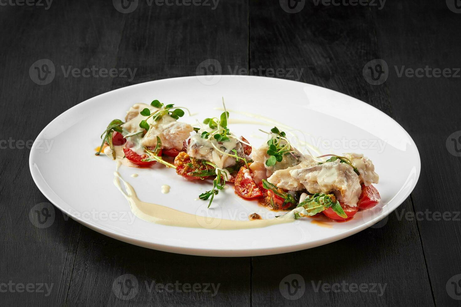 Cod fillet with tomato saute and Alfredo cream cheese sauce 35355443