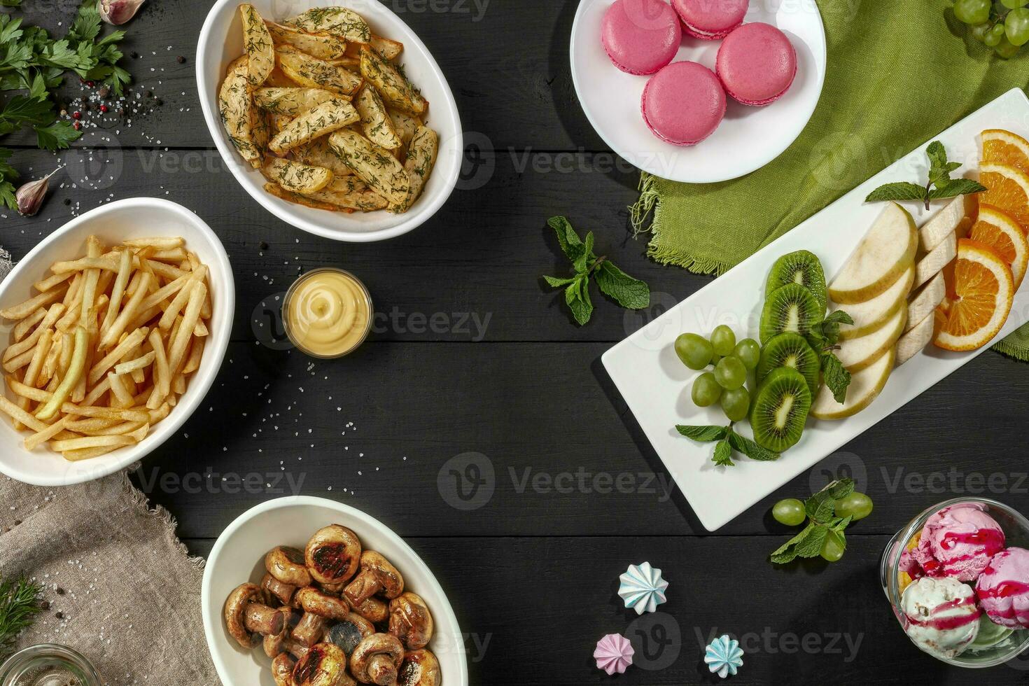 Top view of table with sweet and savory dishes photo