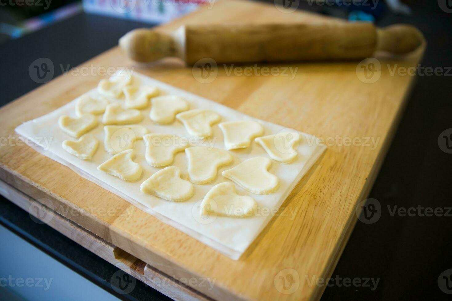 Beautiful dough hearts for cake decoration photo