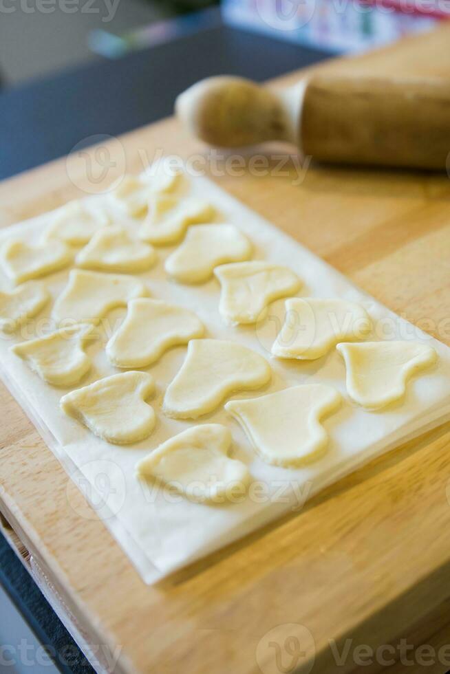Beautiful pattern with dough hearts for decoration. photo