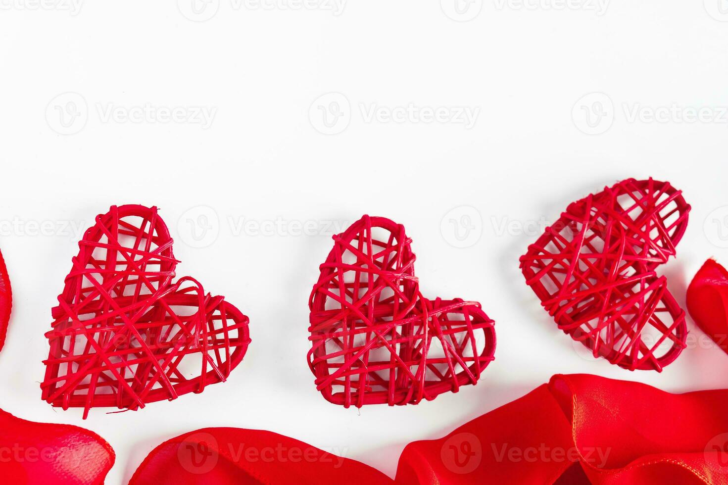 two red ceramic hearts on love letter paper background 6742207