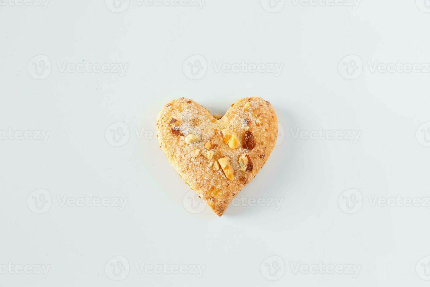 One heart shaped cookie on a white background photo