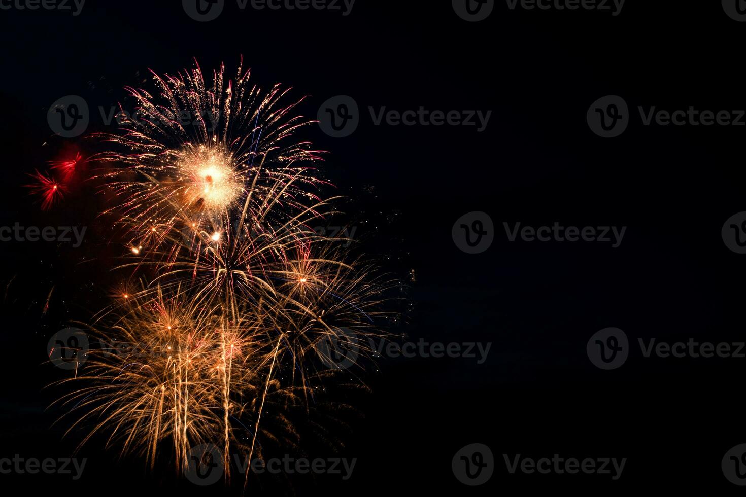 Colorful fireworks on black background. Celebration and holidays concept. Independence Day 4th of July, New Year, festival. Bright explosions of lights in sky. photo