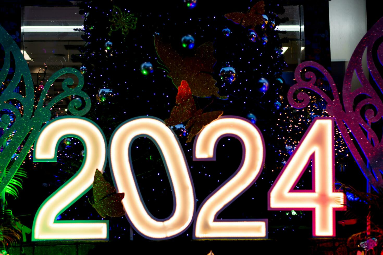 2024 number light sign with New Year and Christmas themes photo