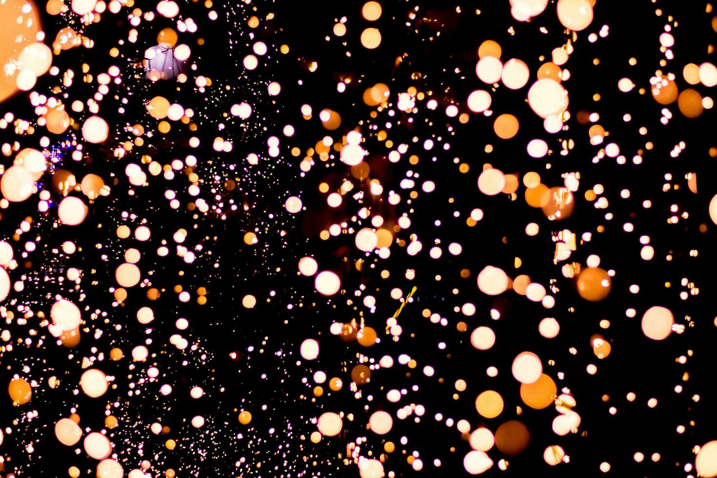 Abstract blur bokeh shot from many tiny light bulbs during the Christmas and New Year festivals. photo