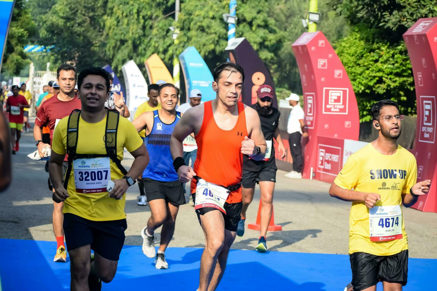 New Delhi, India - October 15 2023 - Vedanta Delhi Half Marathon race after covid in which marathon participants about to cross the finish line, Delhi Half Marathon 2023 photo