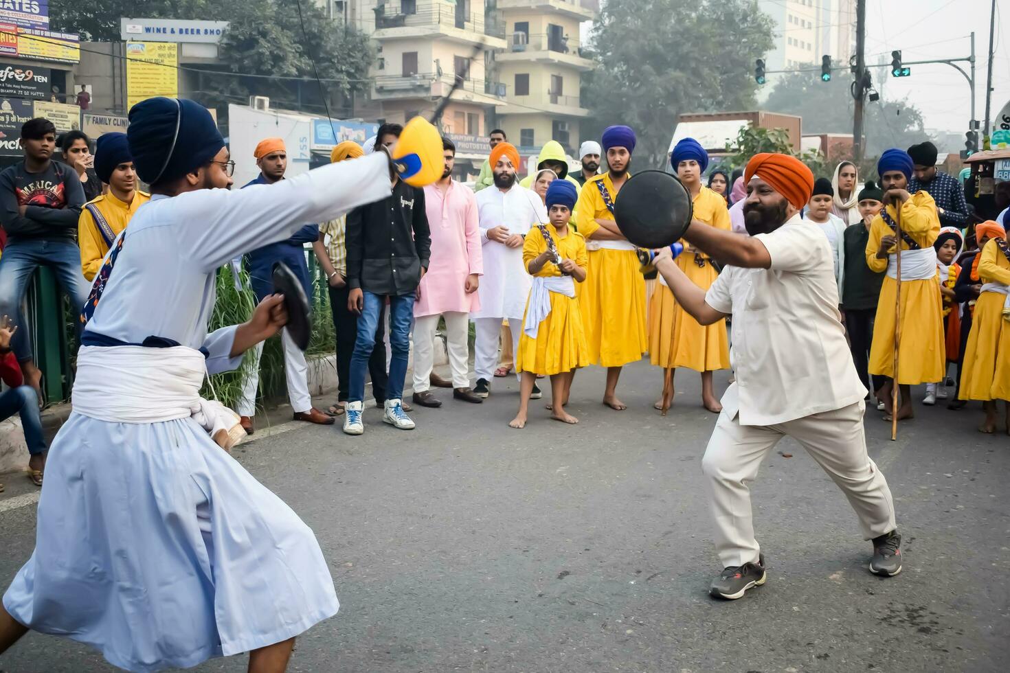 Delhi, India, October 2, 2023 - Sikhs display gatka and martial arts during annual Nagar Kirtan, Traditional, procession on account of birthday of Guru Nanak Dev ji, Nagar Kirtan in East Delhi area photo