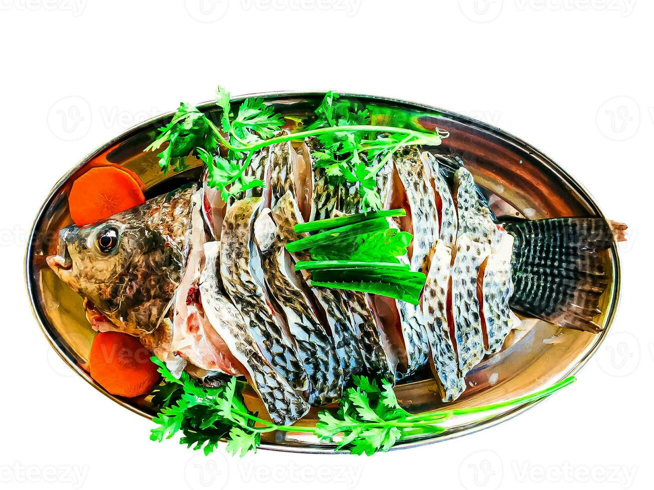 Die-cut image of fish on a plate with vegetables photo