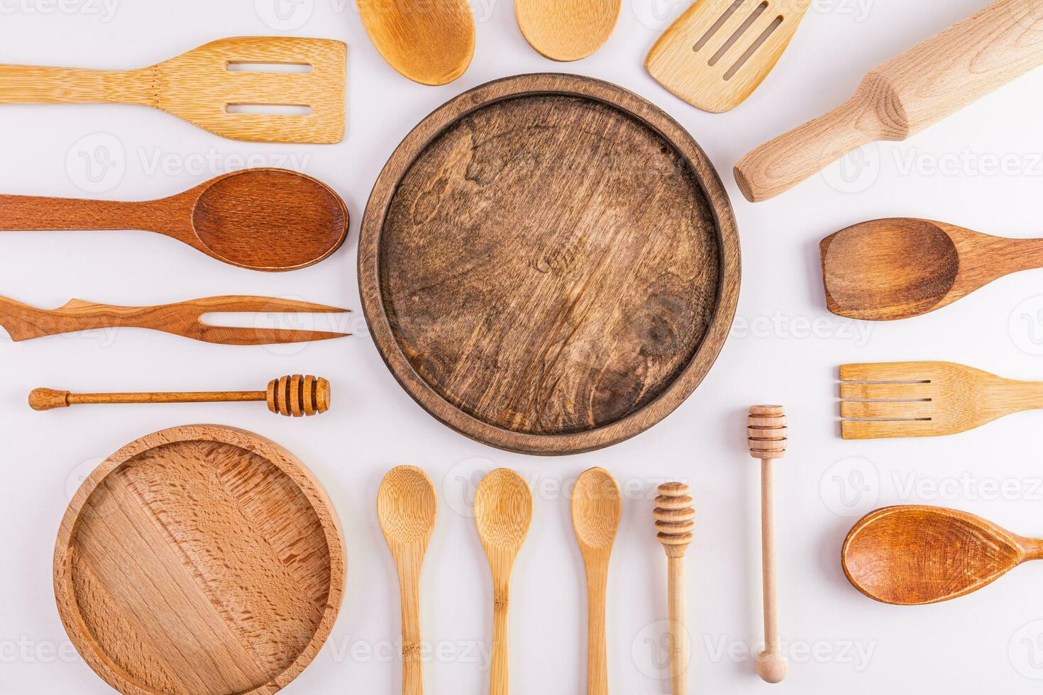 Kitchen background with blank space for text on wooden round trays. Various kitchen utensils and tools on a white background. page for a cookbook. photo