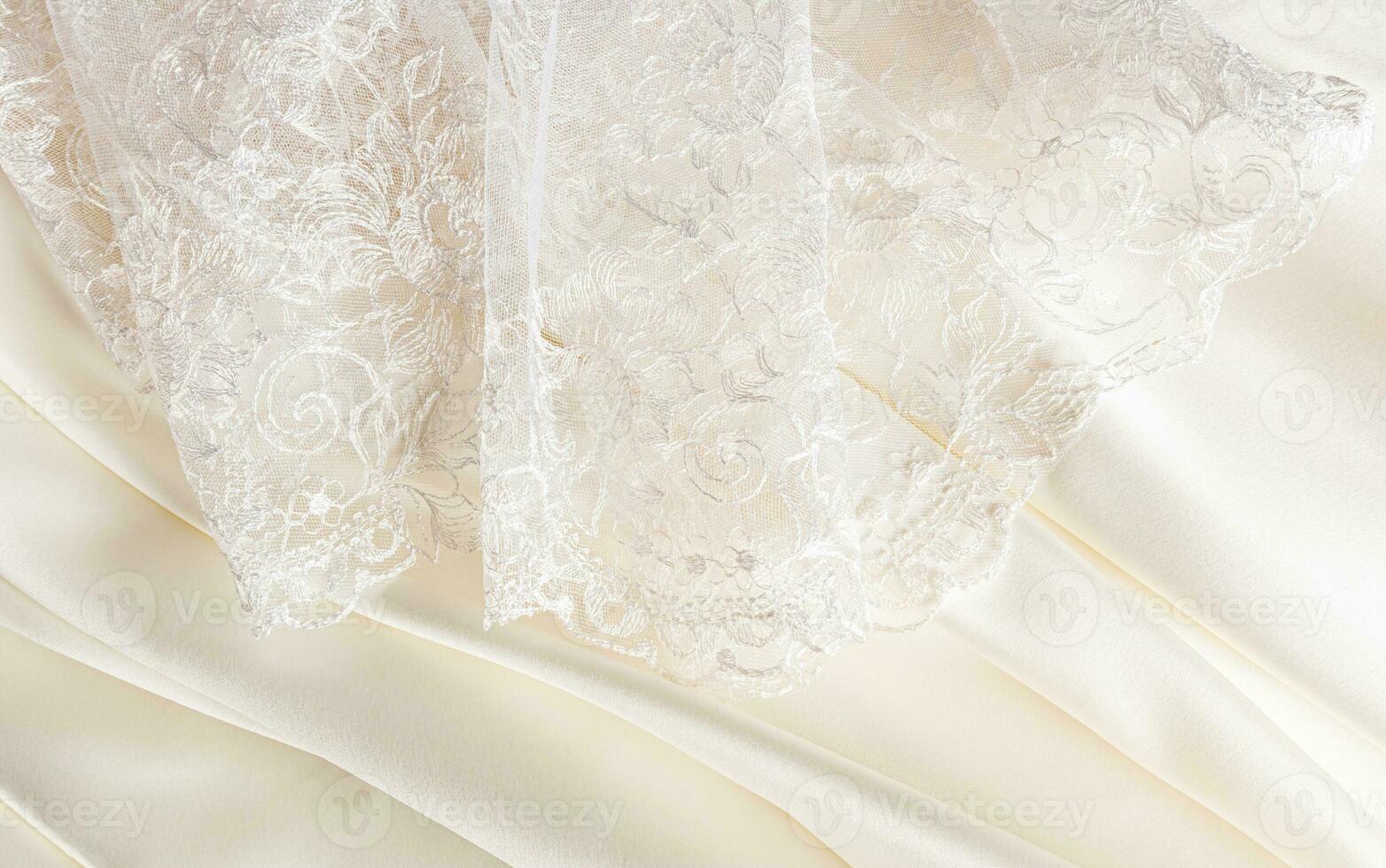 Part of the delicate bridal tulle of the bride and delicate pleats of satin in cream, beige, champagne color. design. mockup photo