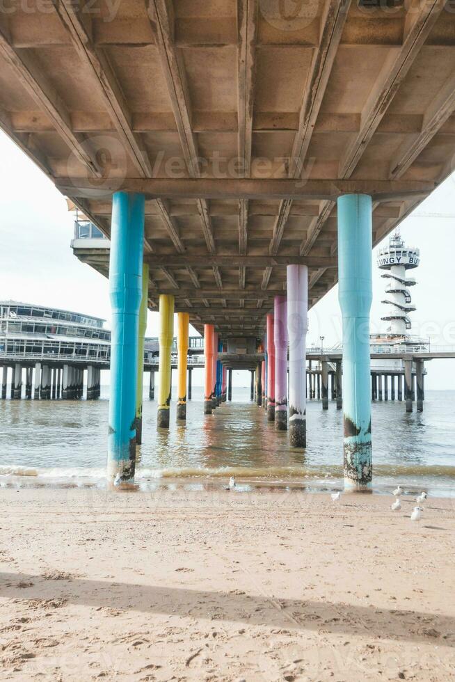 Colourful pedestals for a huge pier on the beach at Den Haag on the west coast of the Netherlands. American style beach photo