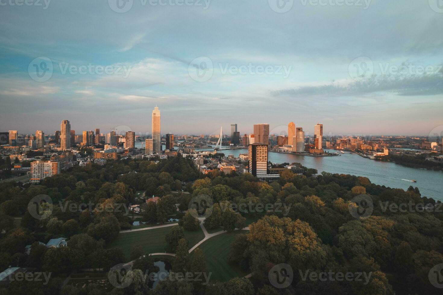 Sunset over Rotterdam city centre and its surrounding park. Sunset in one of the most modern cities in the Netherlands photo