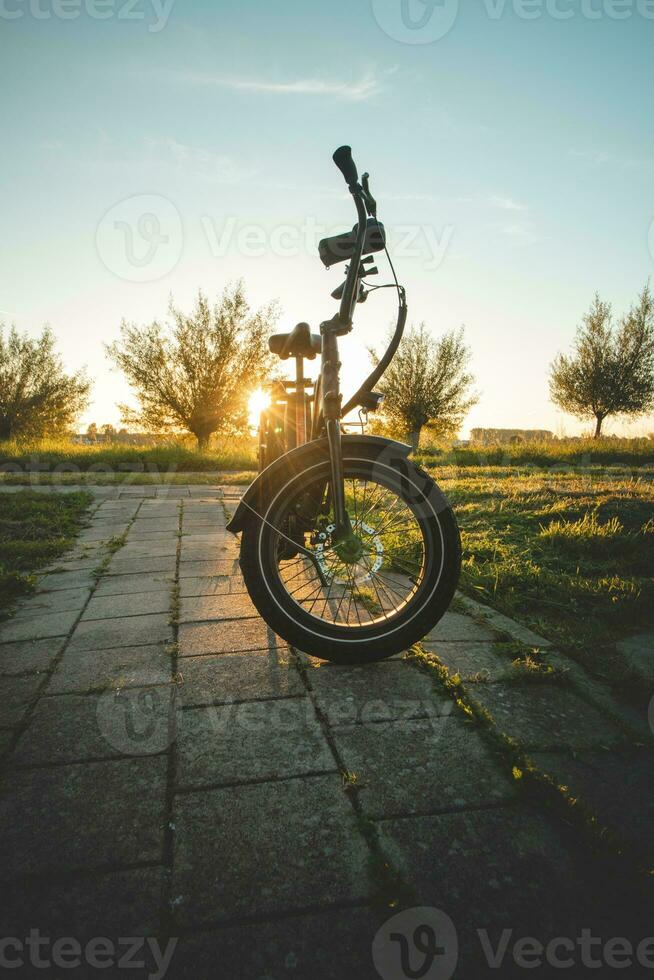 Riding an electric bike during sunset on the suburbs of Amsterdam, the capital of the Netherlands. A leisure activity photo