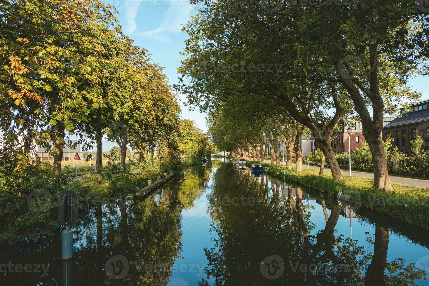 Transportation between cities using a water canal to complement the country's infra-structure. Dutch transport between cities. Shipping photo