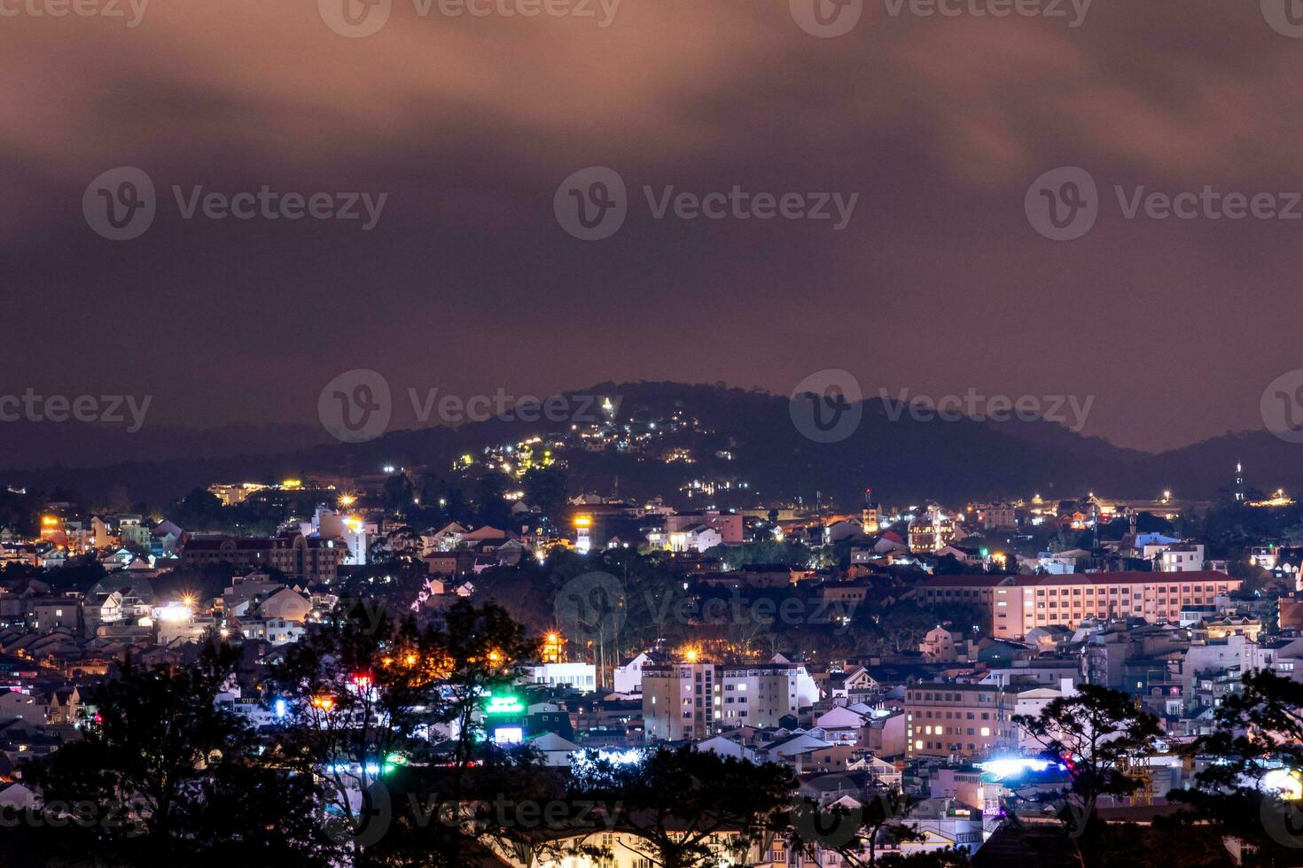 View on roofs in the city of Dalat. Da Lat and the surrounding area is a popular tourist destination of Asia. City with fogs and mountains photo