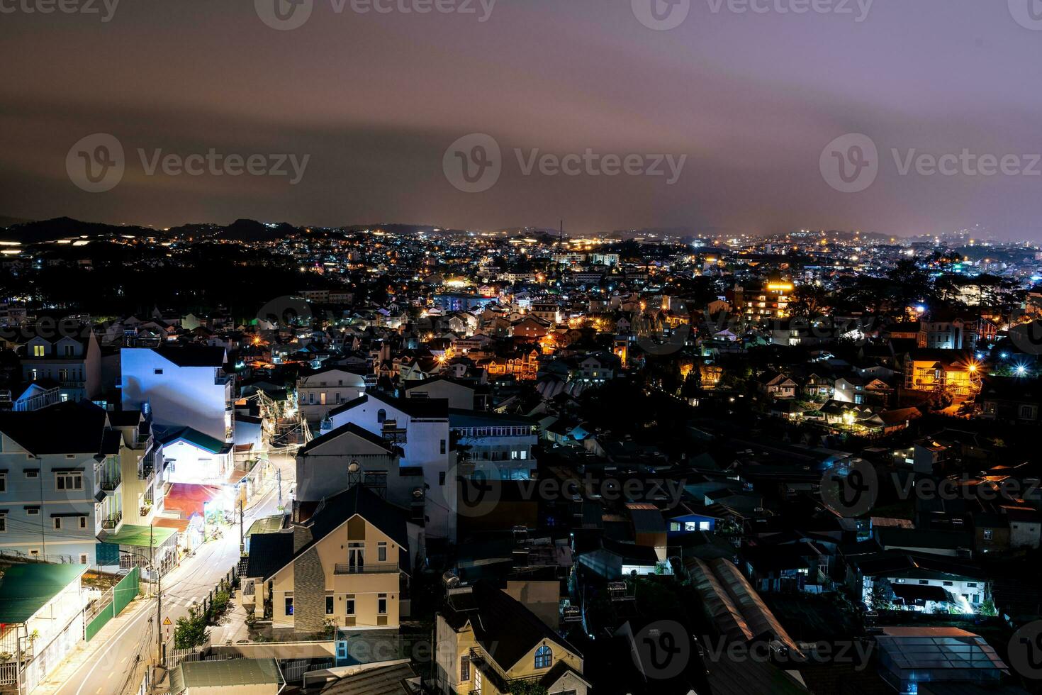 View on roofs in the city of Dalat. Da Lat and the surrounding area is a popular tourist destination of Asia. City with fogs and mountains photo