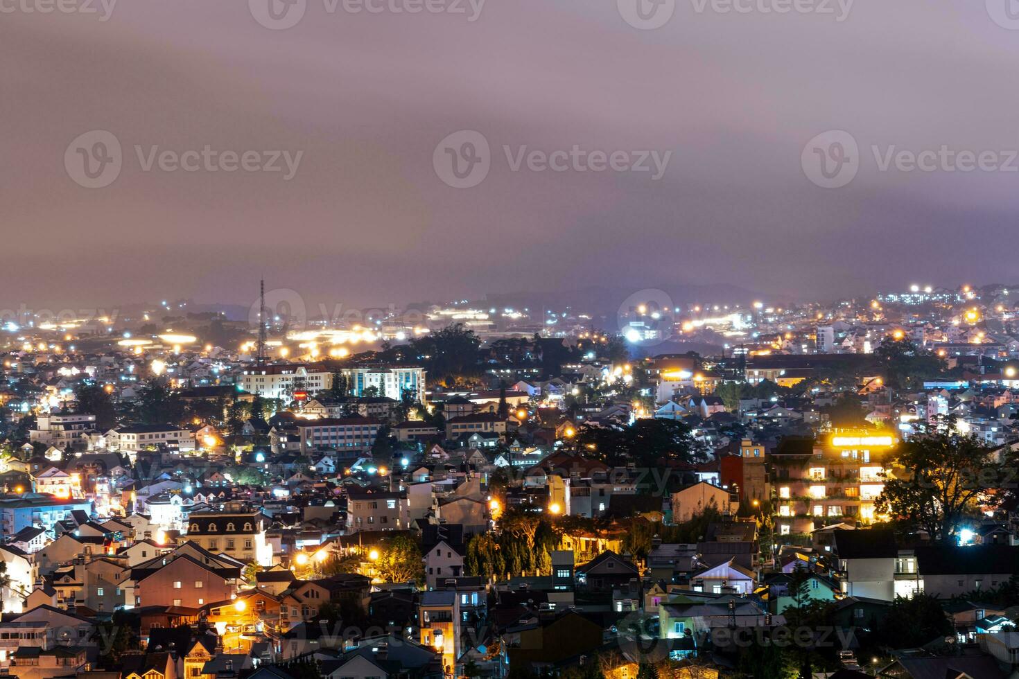 View on roofs in the city of Dalat. Da Lat and the surrounding area is a popular tourist destination of Asia. City with fogs and mountains photo