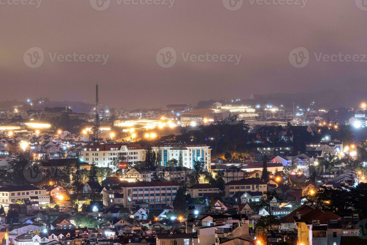View on roofs in the city of Dalat. Da Lat and the surrounding area is a popular tourist destination of Asia. City with fogs and mountains photo