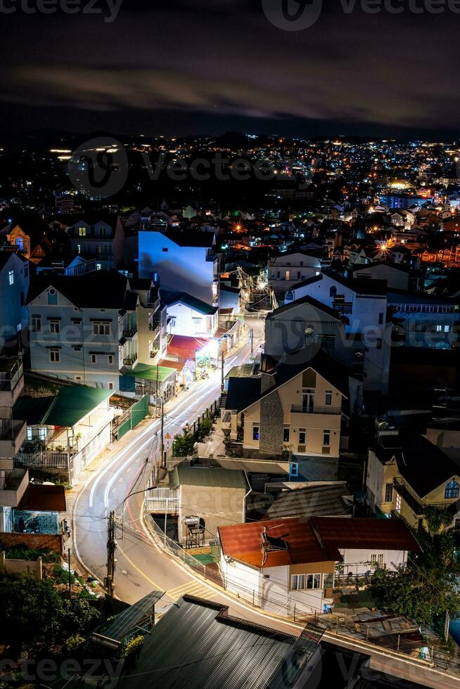 View on roofs in the city of Dalat. Da Lat and the surrounding area is a popular tourist destination of Asia. City with fogs and mountains photo