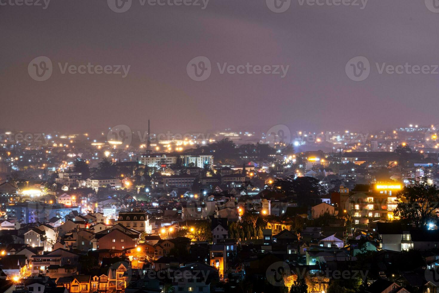 View on roofs in the city of Dalat. Da Lat and the surrounding area is a popular tourist destination of Asia. City with fogs and mountains photo