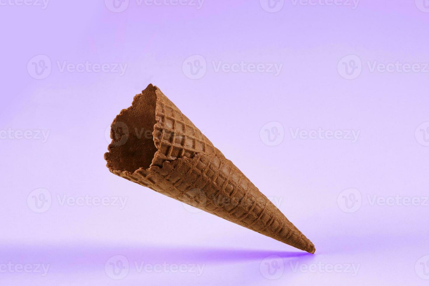 Empty, crunchy, chocolate wafer cone for ice cream isolated on white. Concept of food, treats. Mockup, template for advertising and design. Close up photo
