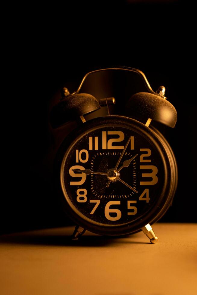 Close-up of a black alarm clock, early morning photo