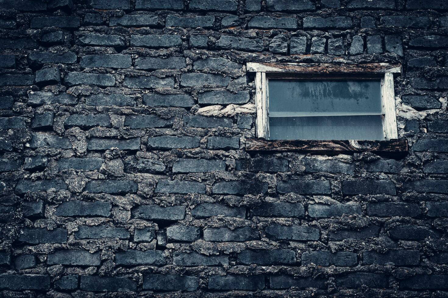 Old Stone Brick Wall with old windows photo