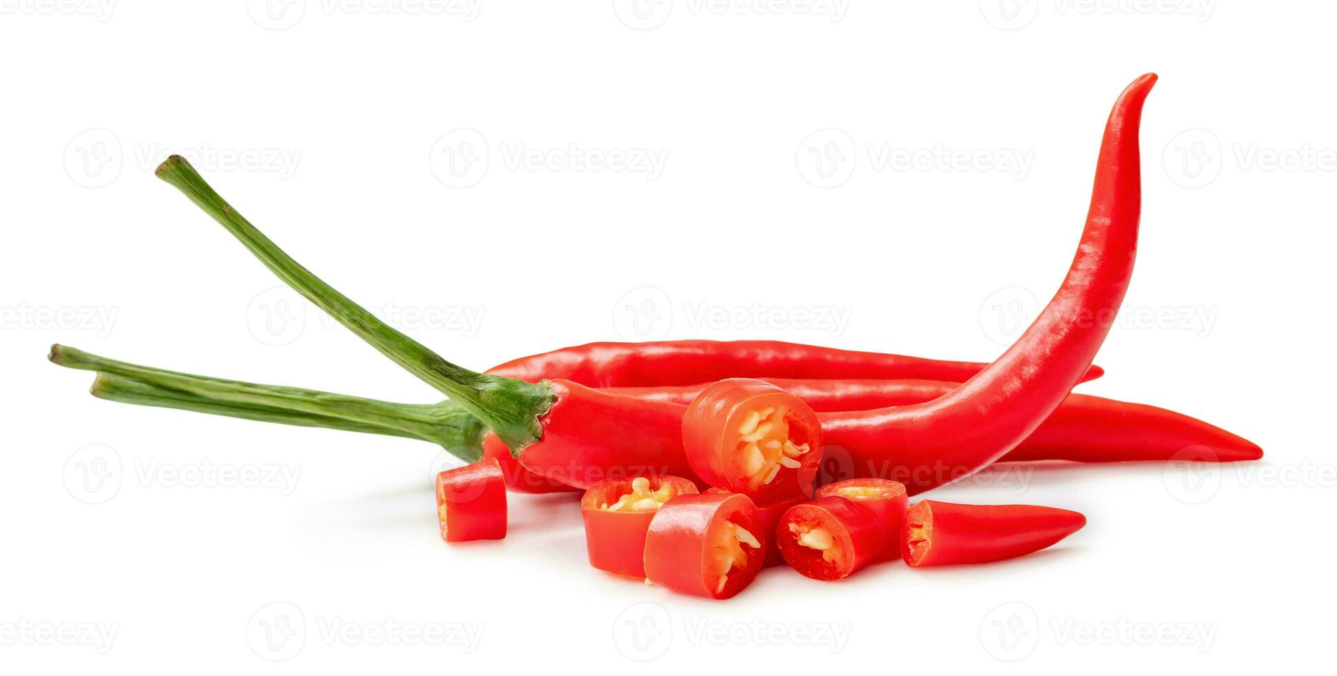 Fresh red chili peppers in stack with slices isolated on white background with clipping path. Front view and flat lay photo