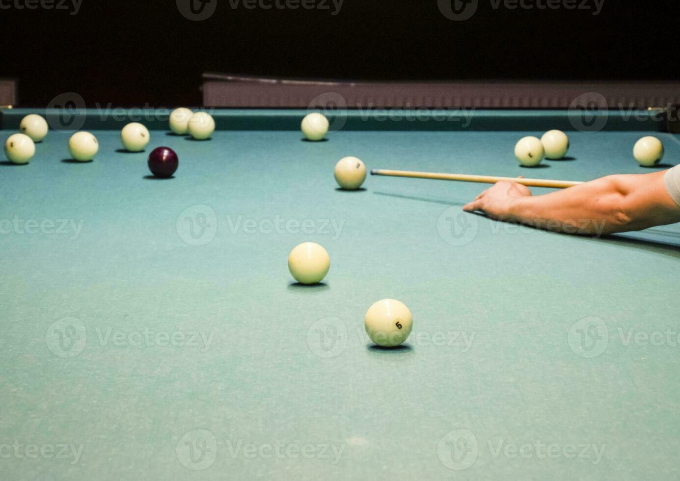 Billiards, billiard table. Targeting the cue in the ball for imp photo