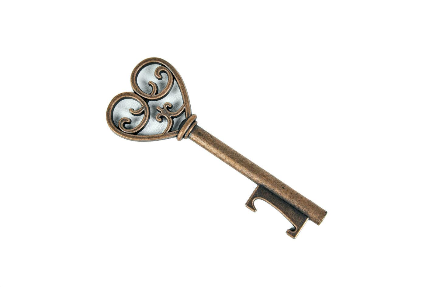 Antique old key on white background photo
